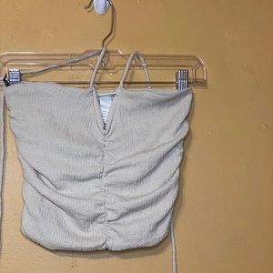 Halter neck crop top with a v detail at the chest